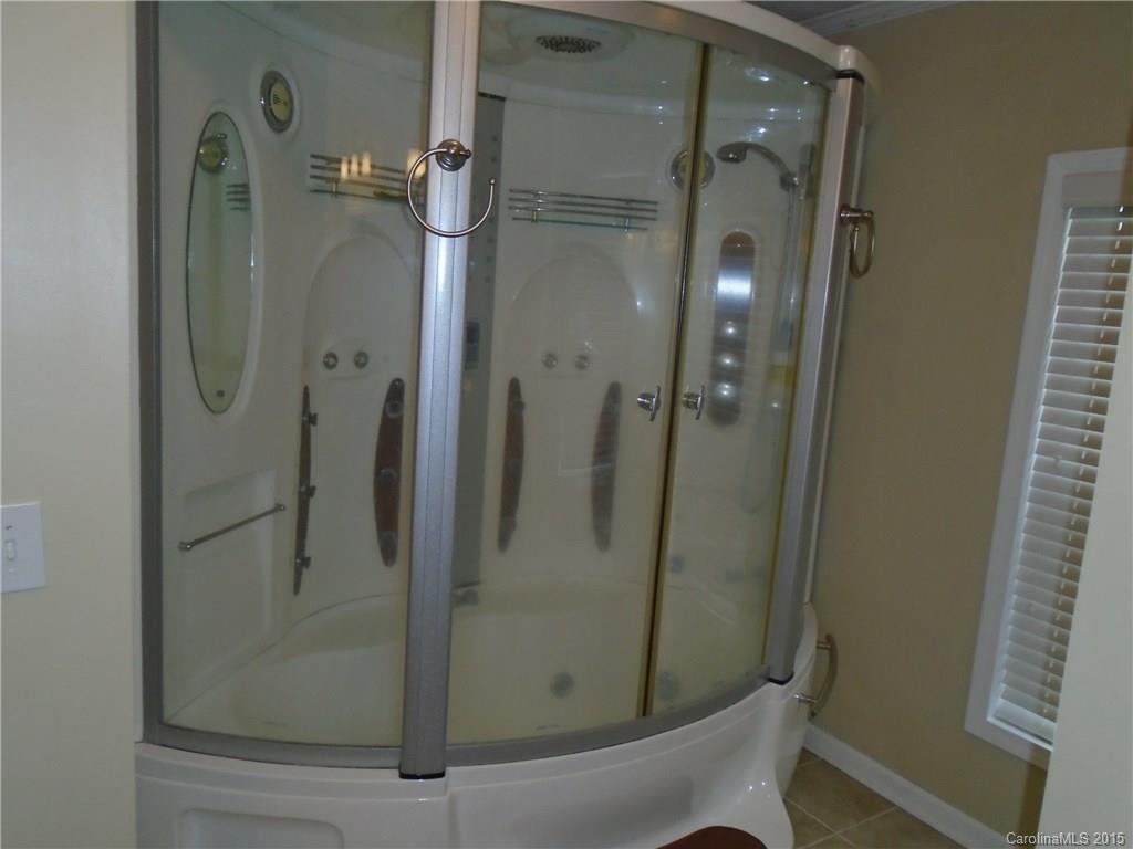1260 Wayfield Road, Unit 3 Clover, SC 29710 - Photo 11 of 24 a bathroom with a glass shower door