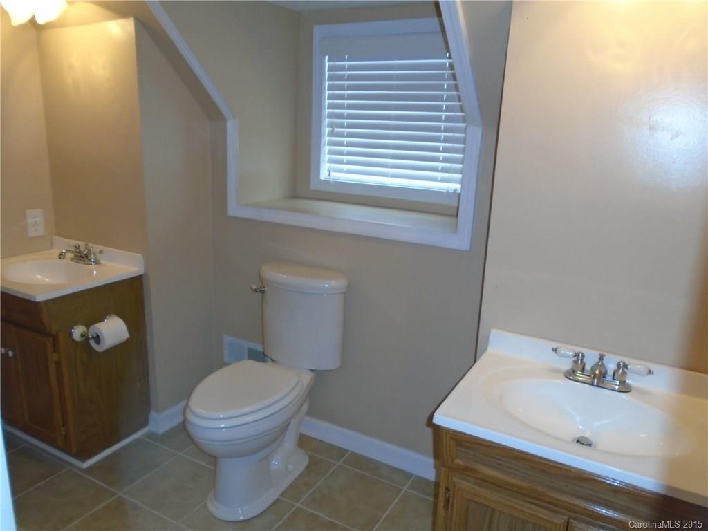 1260 Wayfield Road, Unit 3 Clover, SC 29710 - Photo 15 of 24 a white toilet sitting next to a bathroom sink