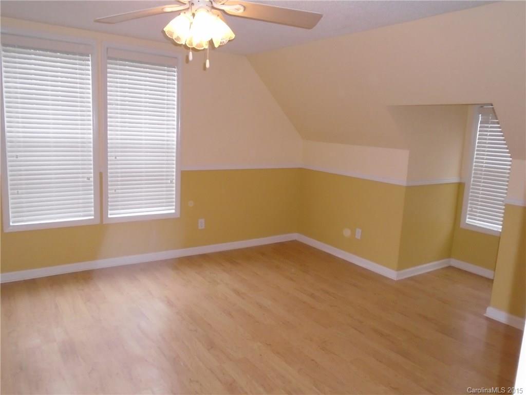 1260 Wayfield Road, Unit 3 Clover, SC 29710 - Photo 17 of 24 a view of an empty room with wooden floor and a window