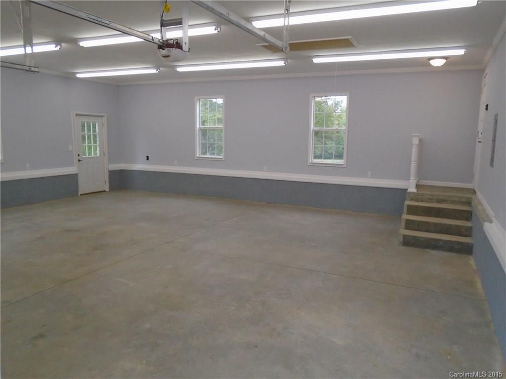 1260 Wayfield Road, Unit 3 Clover, SC 29710 - Photo 19 of 24 an empty room with windows and ceiling fan