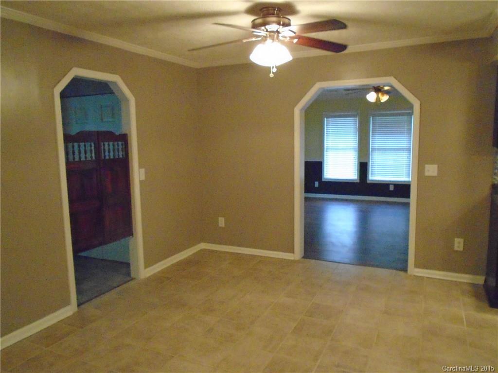 1260 Wayfield Road, Unit 3 Clover, SC 29710 - Photo 5 of 24 an empty room with closet and a chandelier fan