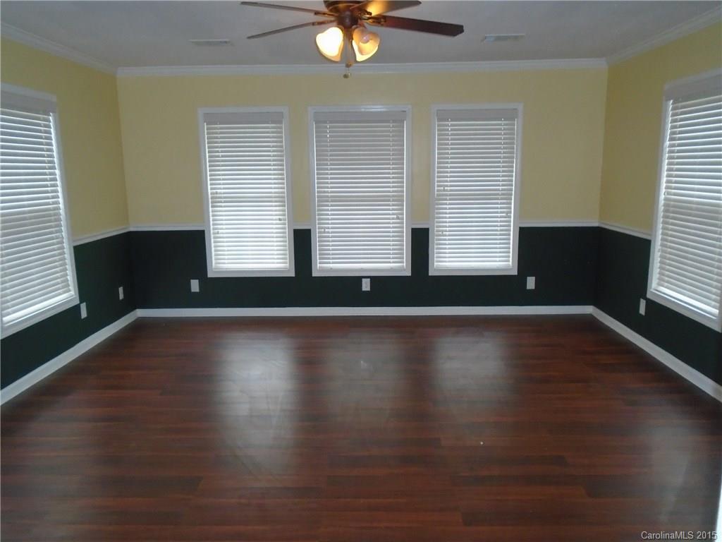 1260 Wayfield Road, Unit 3 Clover, SC 29710 - Photo 7 of 24 an empty room with wooden floor and windows
