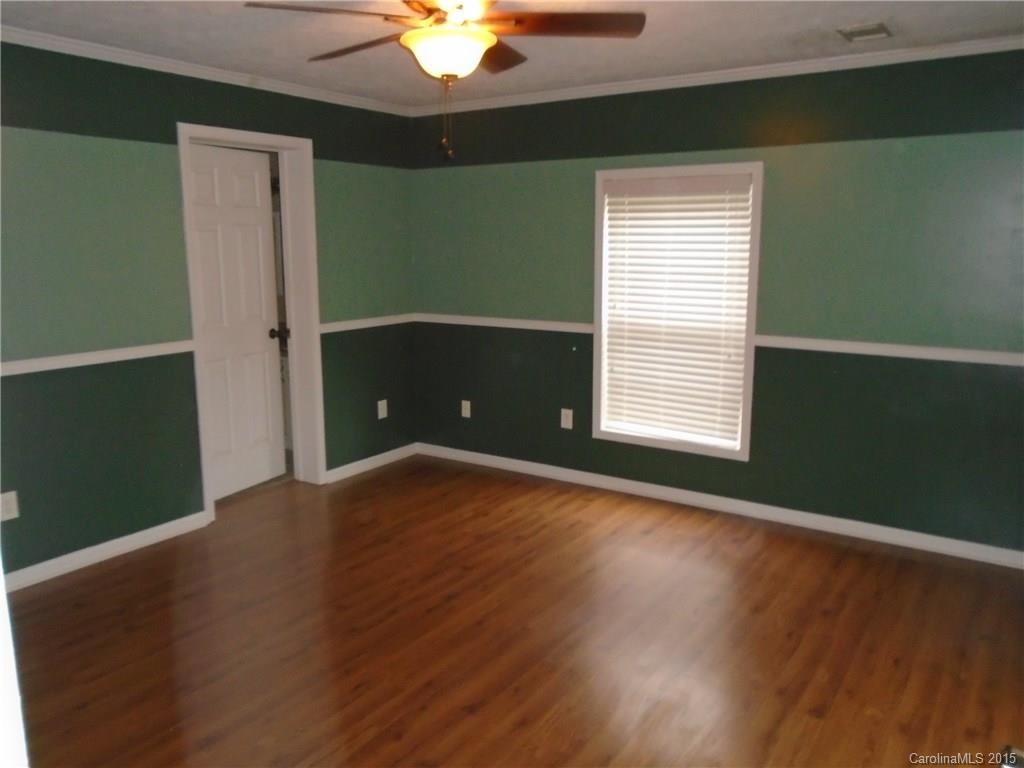 1260 Wayfield Road, Unit 3 Clover, SC 29710 - Photo 9 of 24 an empty room with wooden floor and windows