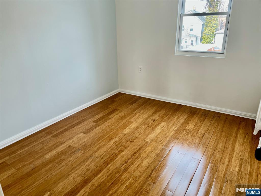46 Webster Street, Unit 2 Ridgefield Park, NJ 07660 - Photo 7 of 10 a view of empty room with wooden floor and fan