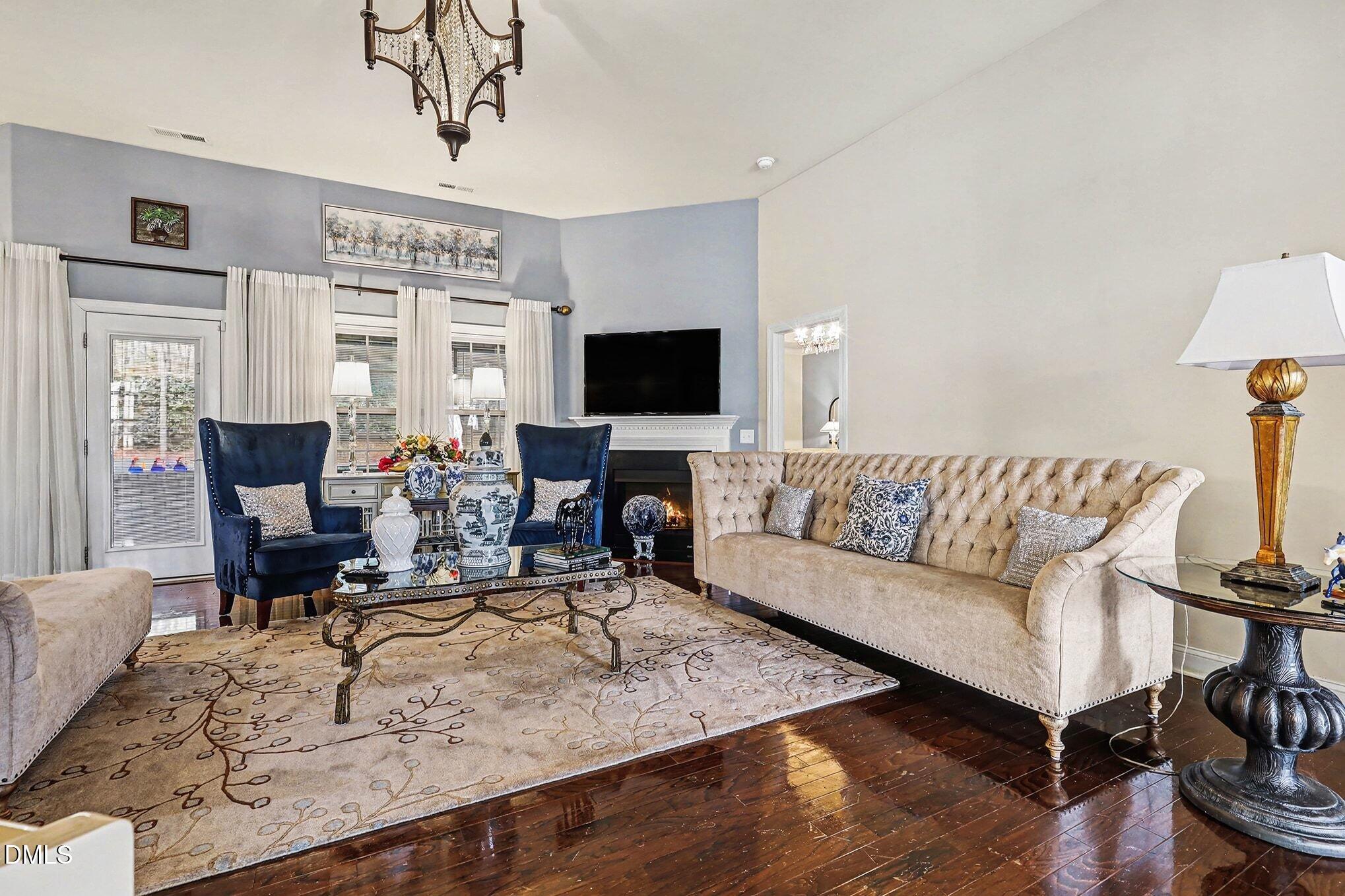 128 Dereham Lane Garner, NC 27529 - Photo 12 of 29 a living room with furniture and a flat screen tv