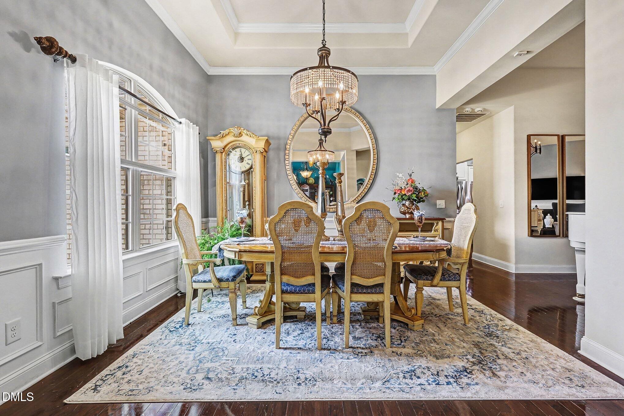 128 Dereham Lane Garner, NC 27529 - Photo 13 of 29 a view of a dining room with furniture window and wooden floor