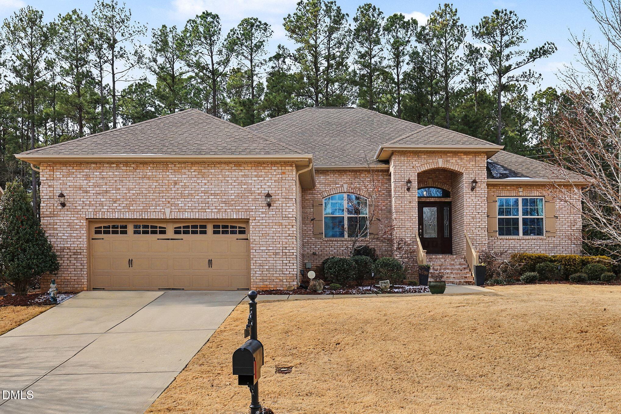 128 Dereham Lane Garner, NC 27529 - Photo 28 of 29 a front view of a house with a yard
