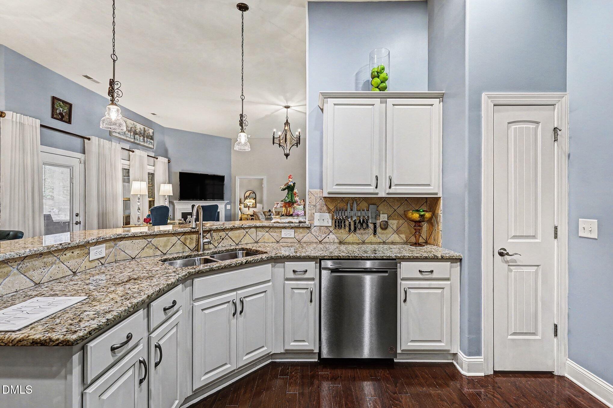 128 Dereham Lane Garner, NC 27529 - Photo 9 of 29 a kitchen with stainless steel appliances granite countertop a sink and a granite counter tops