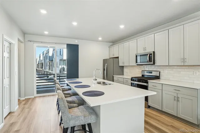 a bathroom with a sink a mirror and toilet