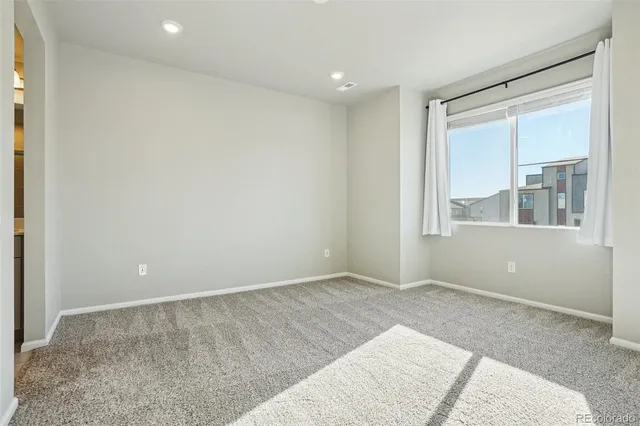 an empty room with large window