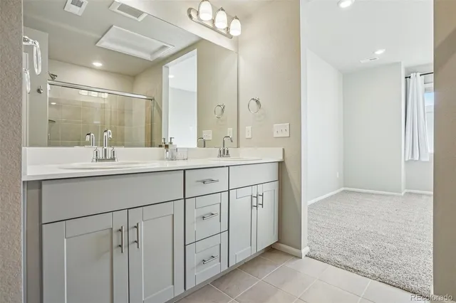 a view of livingroom with hardwood floor and a kitchen