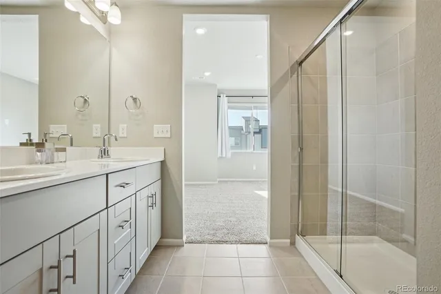 a bathroom with a sink mirror vanity and toilet