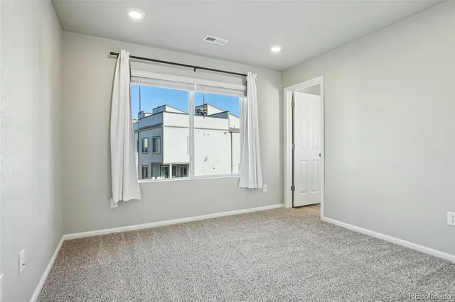 a utility room with washing machine and sink