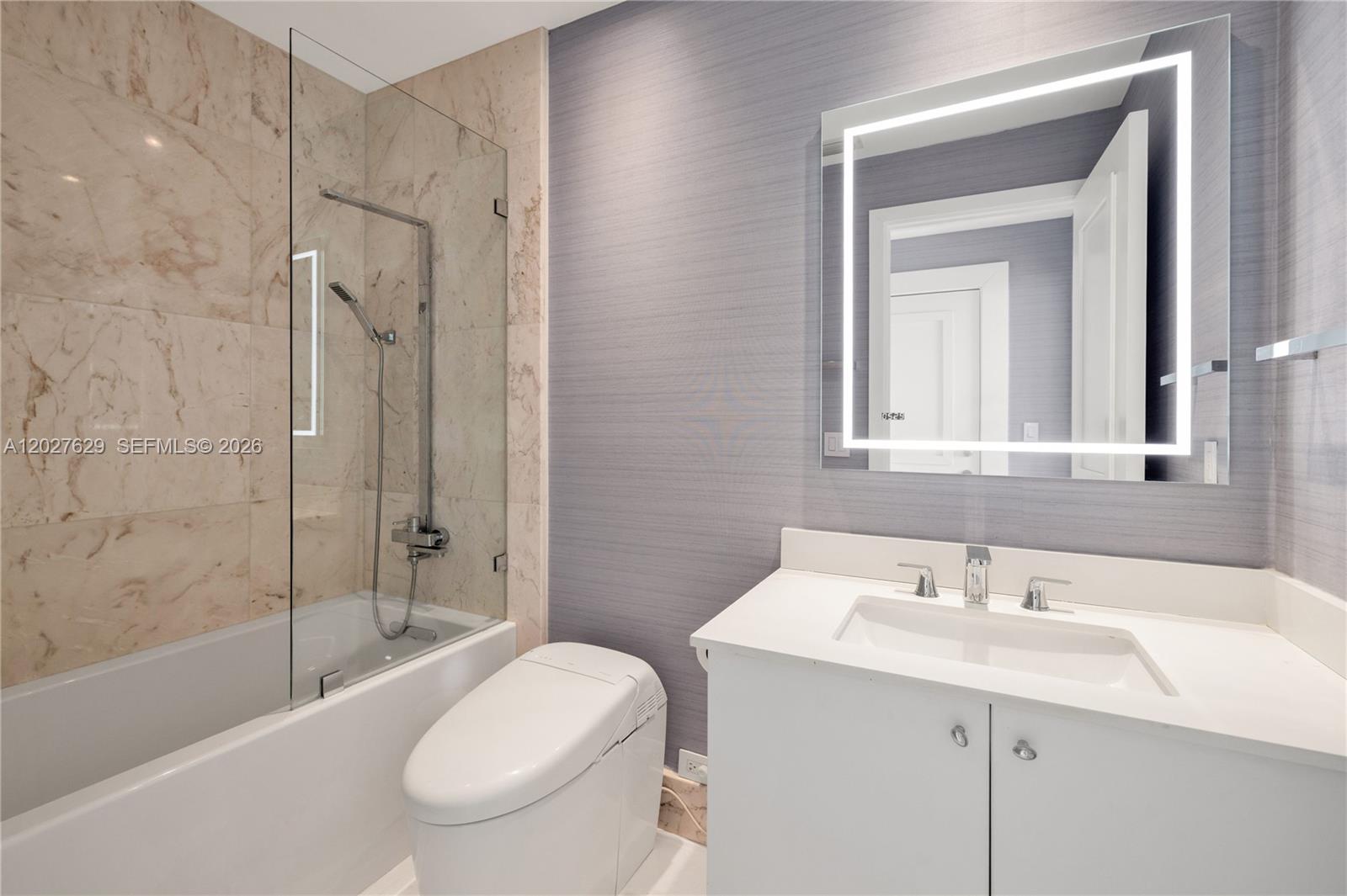 799 Crandon Boulevard, Unit PH8 Key Biscayne, FL 33149 - Photo 15 of 47 a bathroom with a sink toilet and shower