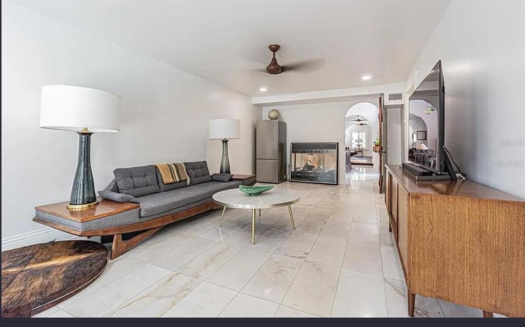 1175 Jackson Road Clearwater, FL 33755 - Photo 12 of 23 a living room with furniture and a flat screen tv