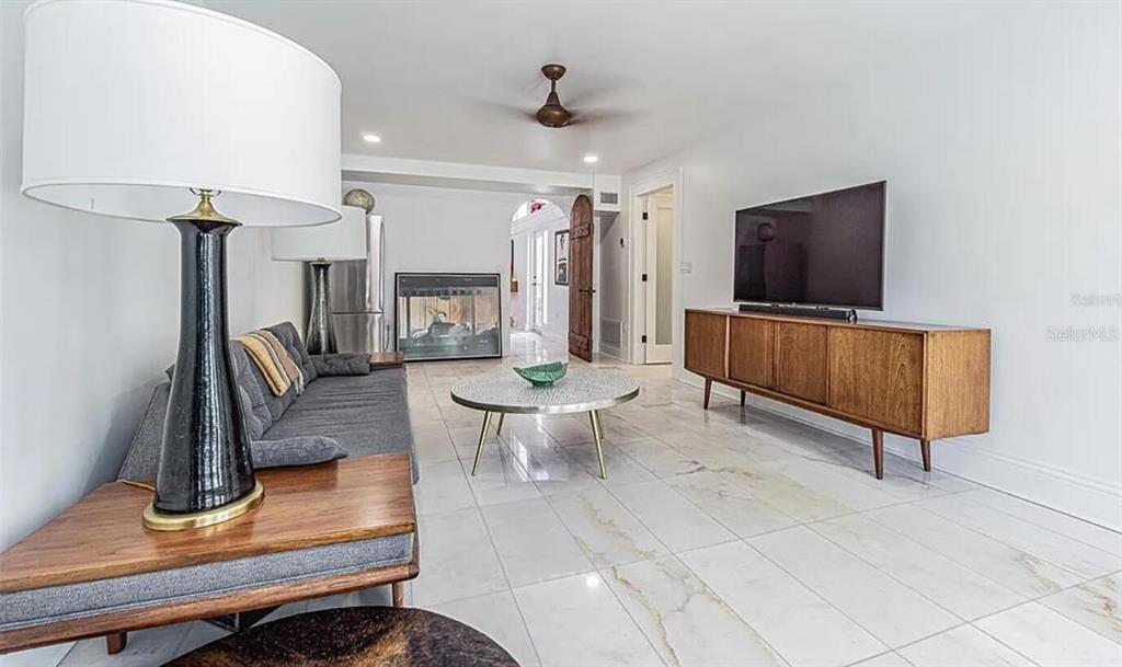 1175 Jackson Road Clearwater, FL 33755 - Photo 14 of 23 a living room with furniture and a flat screen tv