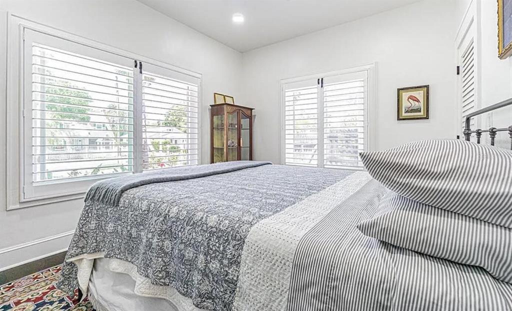 1175 Jackson Road Clearwater, FL 33755 - Photo 18 of 23 a bedroom with a bed and a large window