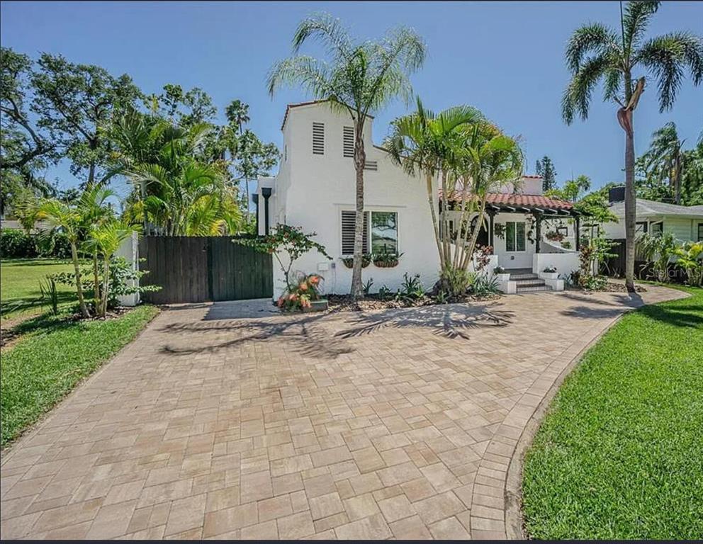 1175 Jackson Road Clearwater, FL 33755 - Photo 3 of 23 a view of backyard with a garden and palm trees
