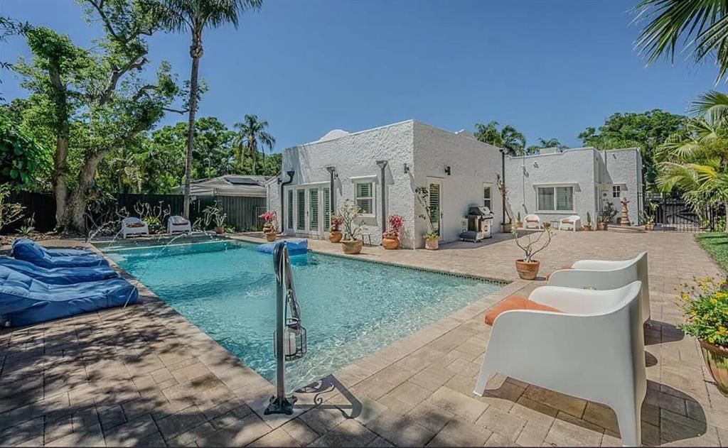 1175 Jackson Road Clearwater, FL 33755 - Photo 4 of 23 a swimming pool with outdoor seating yard and patio