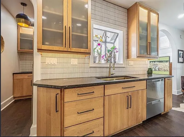 a kitchen with appliances cabinets and a sink