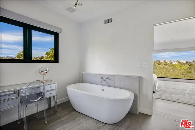 a kitchen that has a cabinets and a stove in it