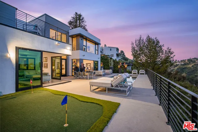 a view of swimming pool with outdoor seating