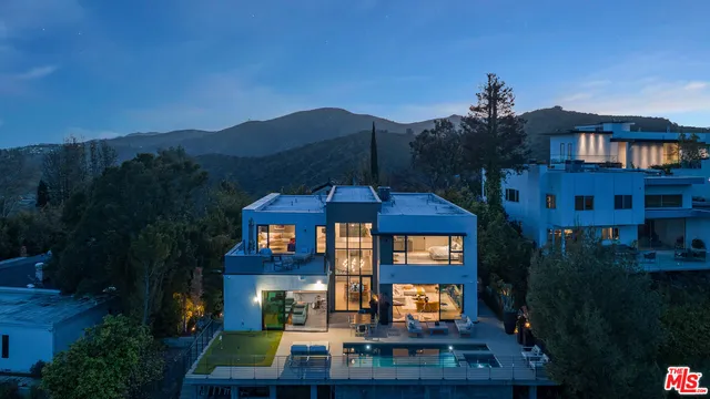 a view of a patio with a table under an umbrella