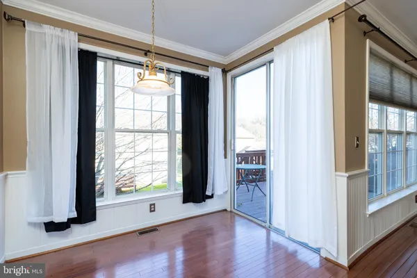 a kitchen with a sink cabinets and a large window