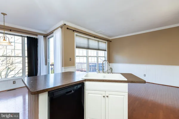 a kitchen with a refrigerator stove and sink