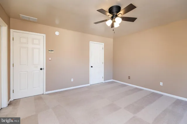 a bathroom with a double vanity sink and mirror with bathtub