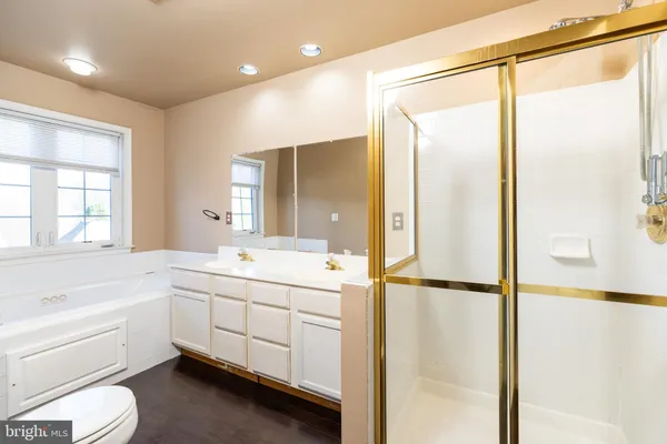 a bathroom with a sink a toilet and bathtub