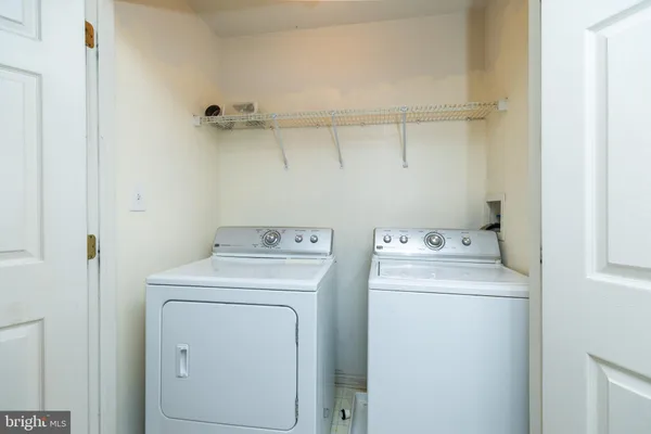 a view of a balcony with a table and chairs