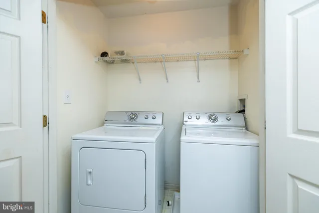 a view of a balcony with a table and chairs