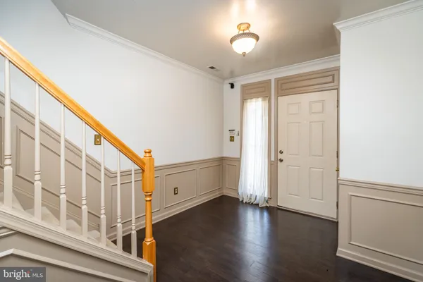 a view of an entryway with wooden floor