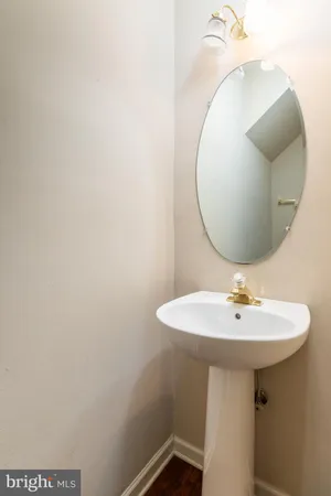 a bathroom with a sink a mirror and vanity