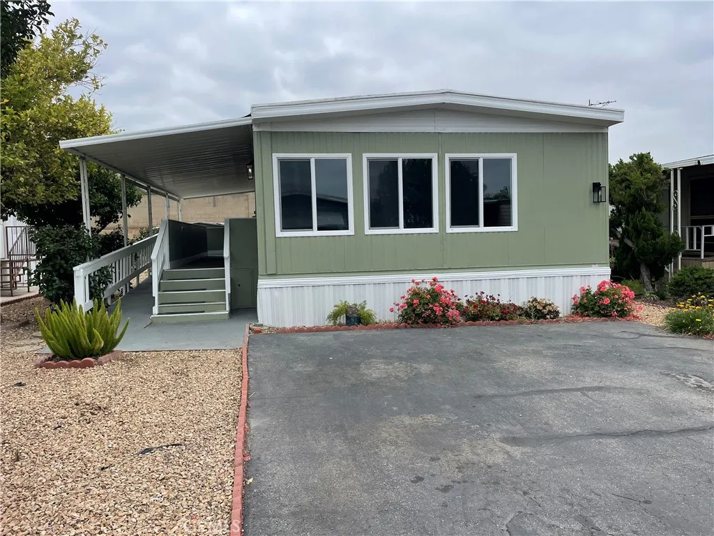 3700 Buchanan Street, Unit 23 Riverside, CA 92503 - Photo 1 of 1 a front view of a house with garden