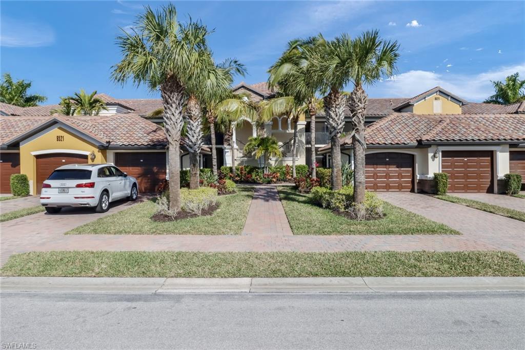 9521 Avellino Way, Unit 2415 Naples, FL 34113 - Photo 21 of 48 front view of house with a street