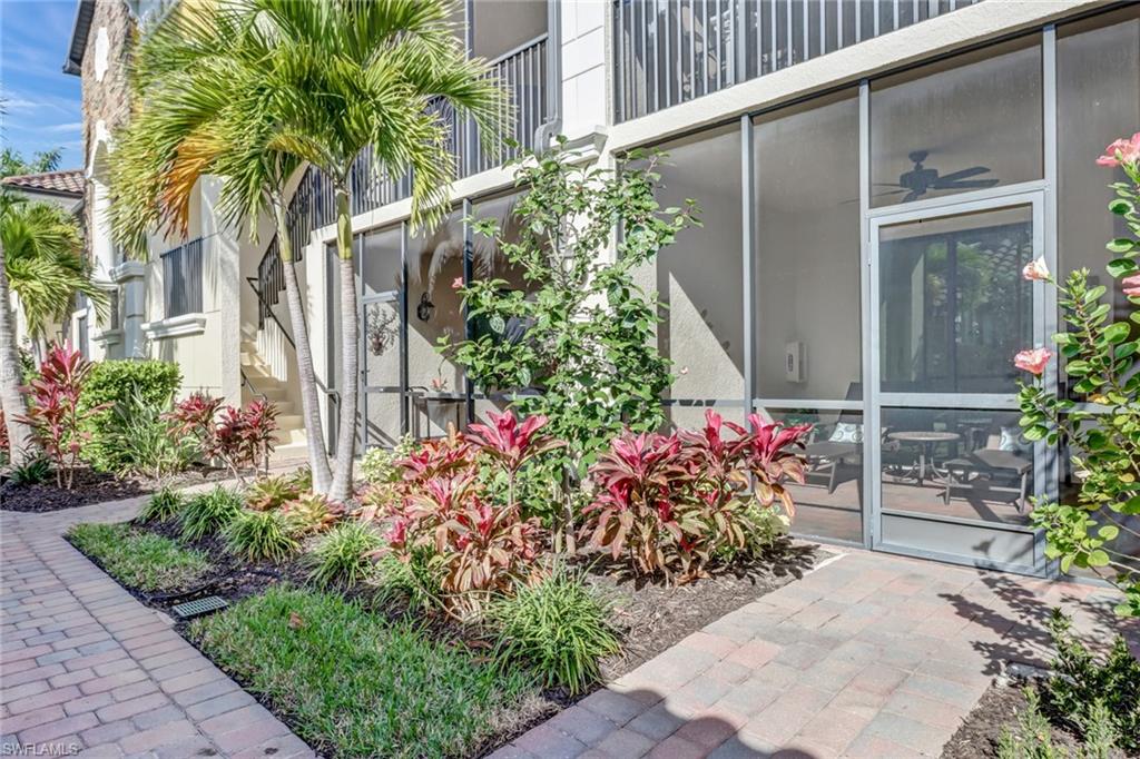 9521 Avellino Way, Unit 2415 Naples, FL 34113 - Photo 22 of 48 a front view of a house having fountain