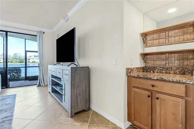 a kitchen with stainless steel appliances granite countertop a stove and a refrigerator