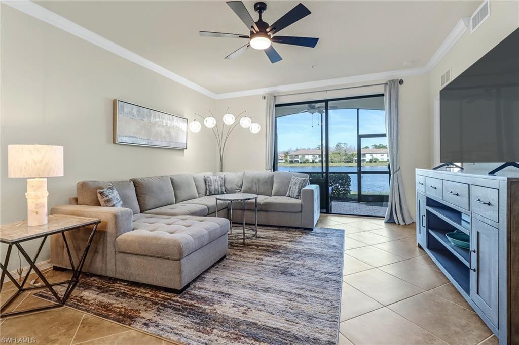 9521 Avellino Way, Unit 2415 Naples, FL 34113 - Photo 33 of 48 a living room with furniture and a fireplace