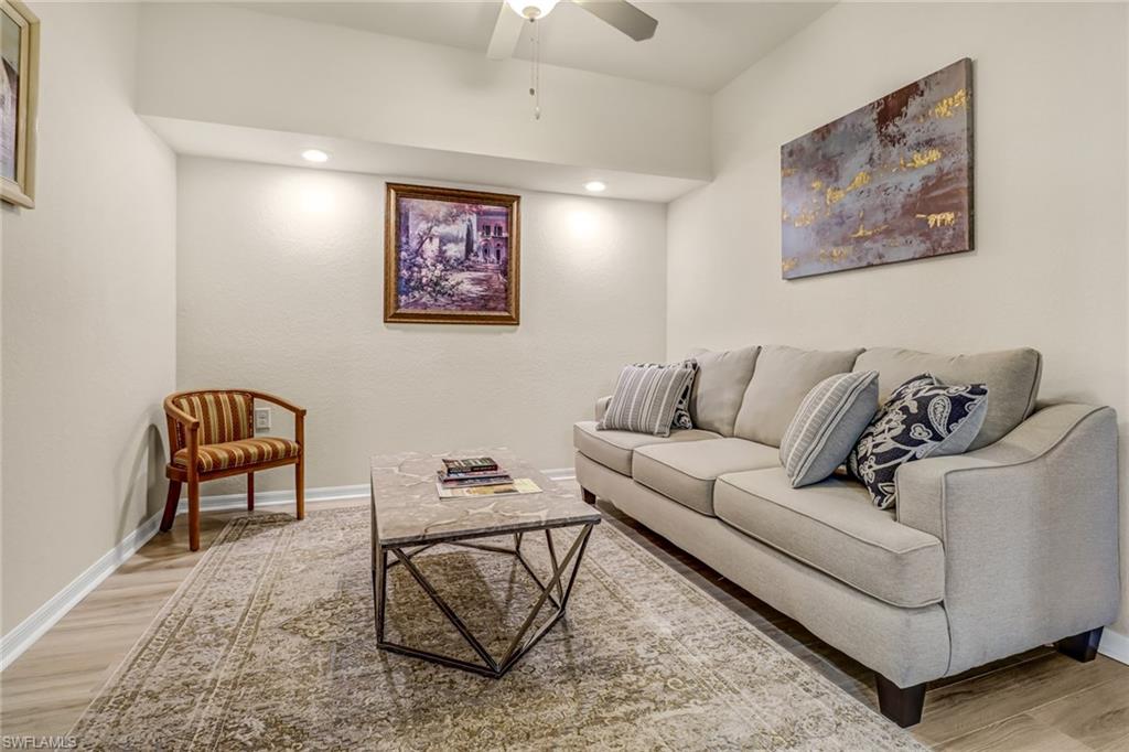 9521 Avellino Way, Unit 2415 Naples, FL 34113 - Photo 41 of 48 a living room with furniture