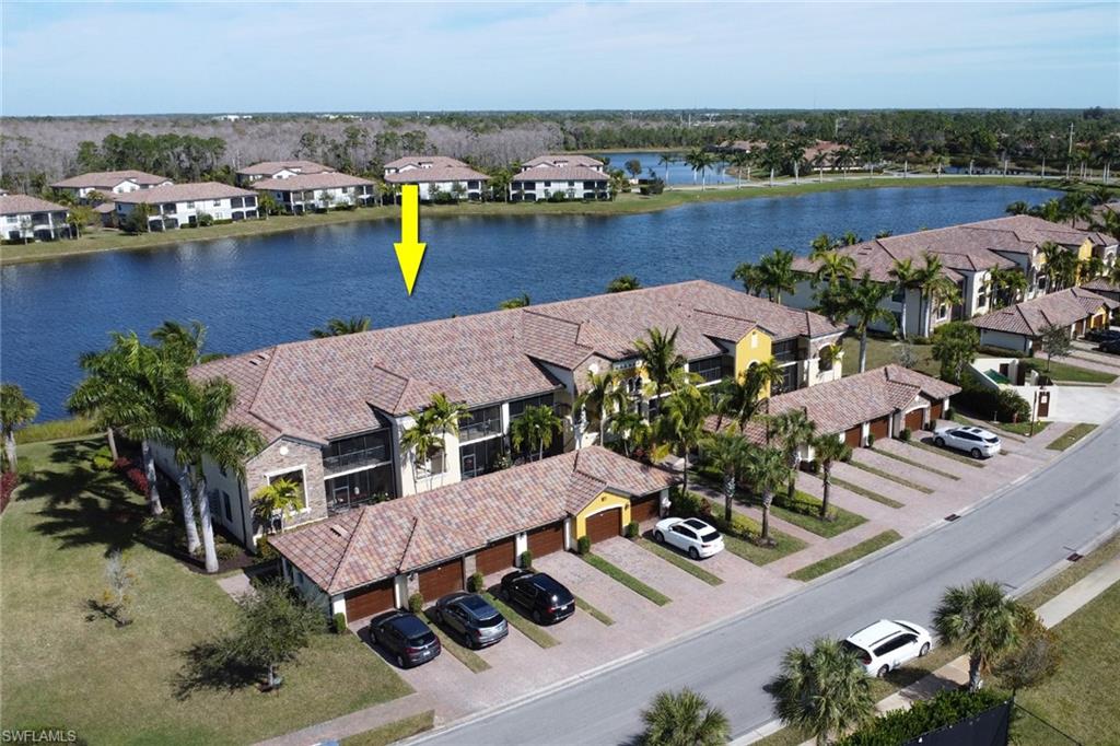 9521 Avellino Way, Unit 2415 Naples, FL 34113 - Photo 46 of 48 an aerial view of house with yard and ocean view