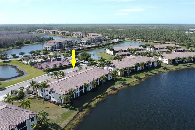 an aerial view of a city with lake view