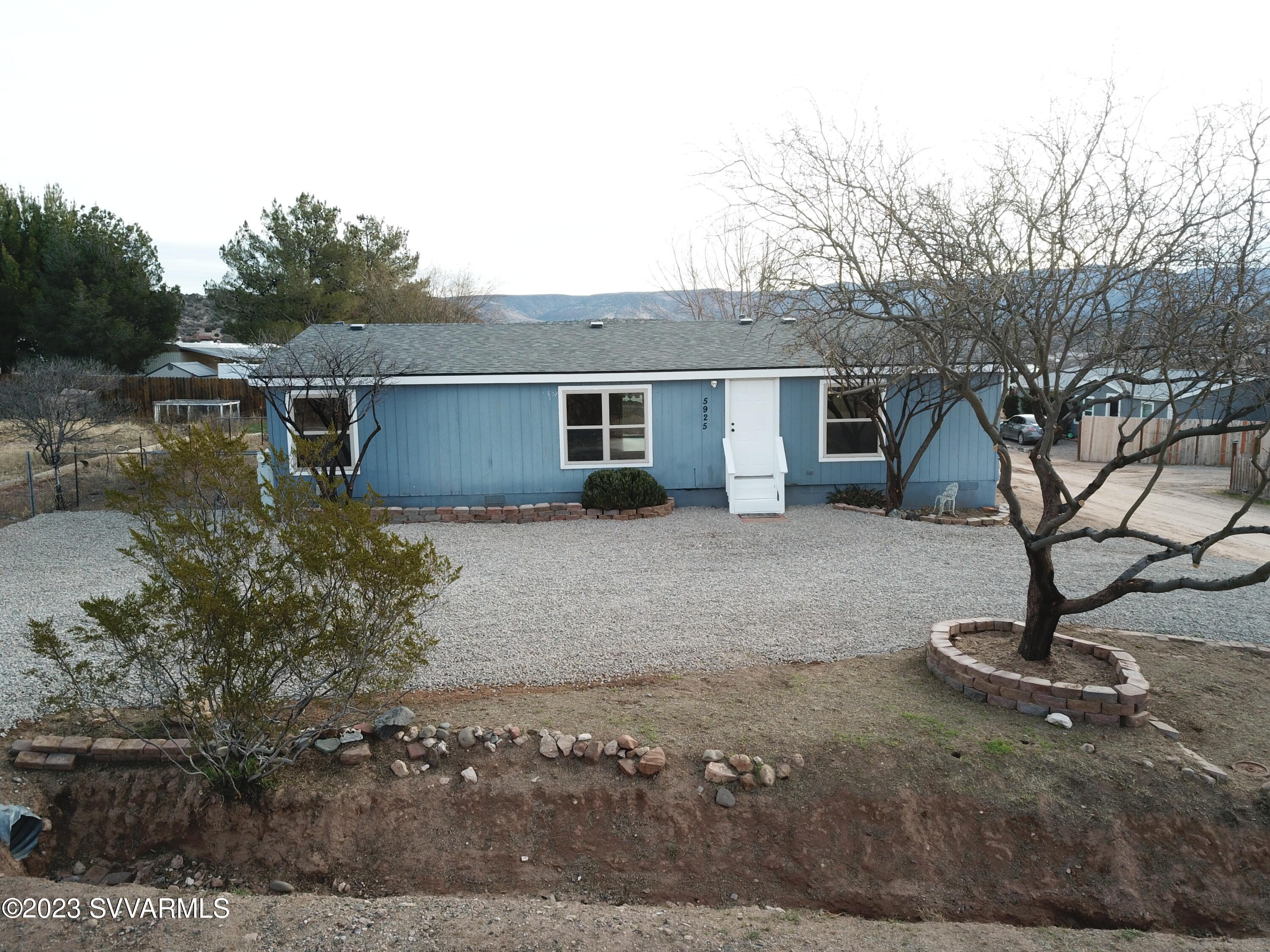 5925 Point Of View Trail Rimrock, AZ 86335 - Photo 1 of 35 a view of a house with backyard and trees