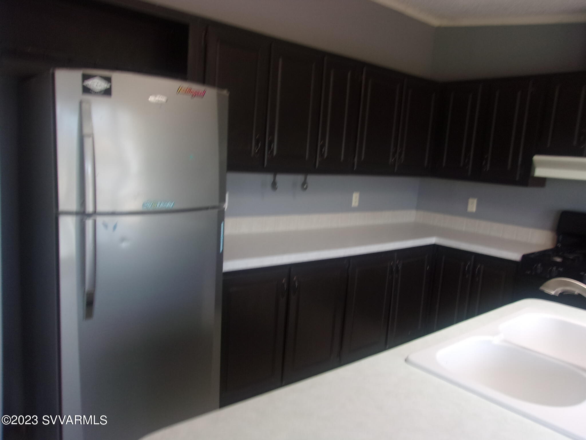 5925 Point Of View Trail Rimrock, AZ 86335 - Photo 11 of 35 a white refrigerator freezer sitting in a kitchen