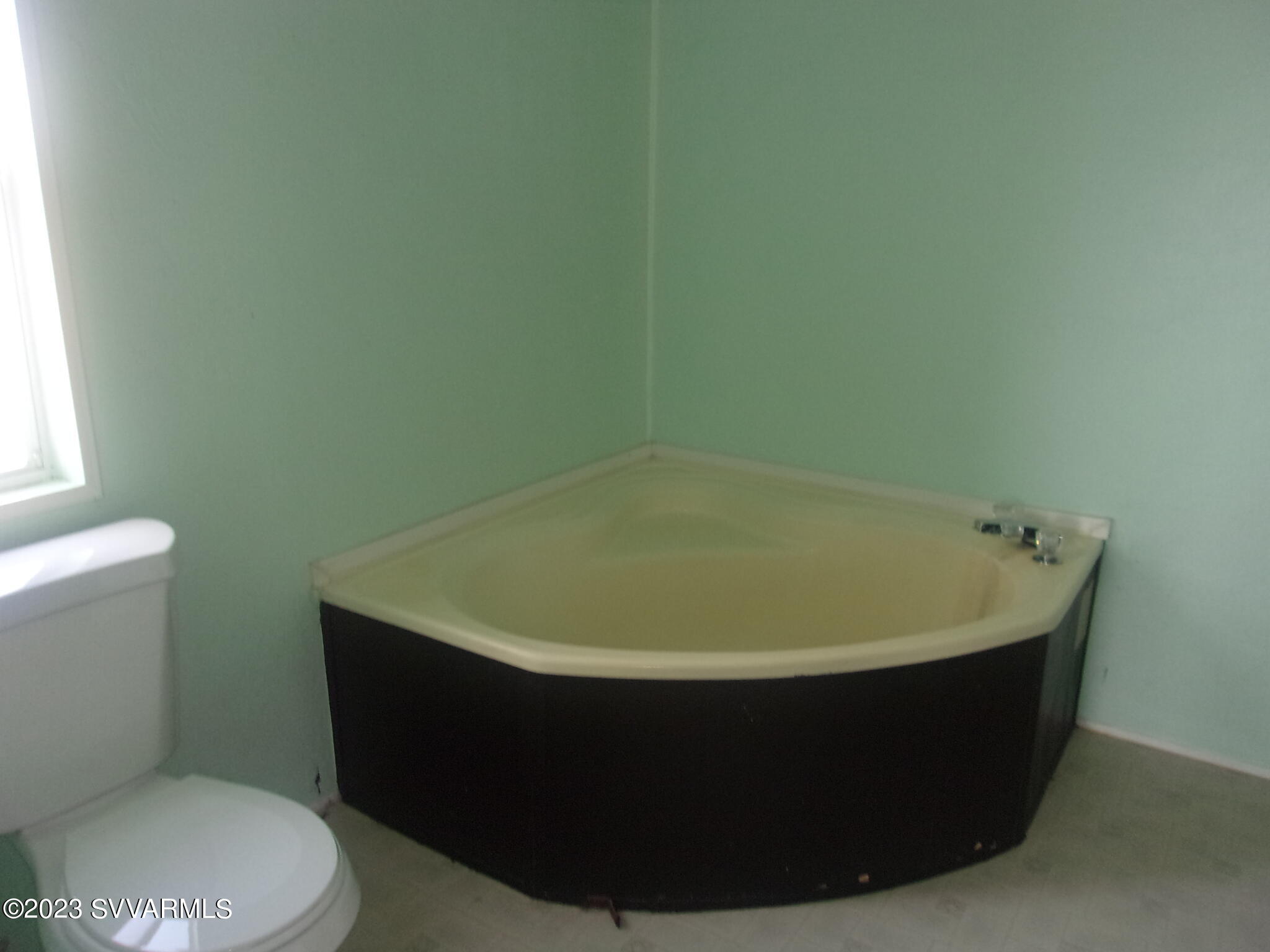 5925 Point Of View Trail Rimrock, AZ 86335 - Photo 14 of 35 a white bath tub sitting in a bathroom