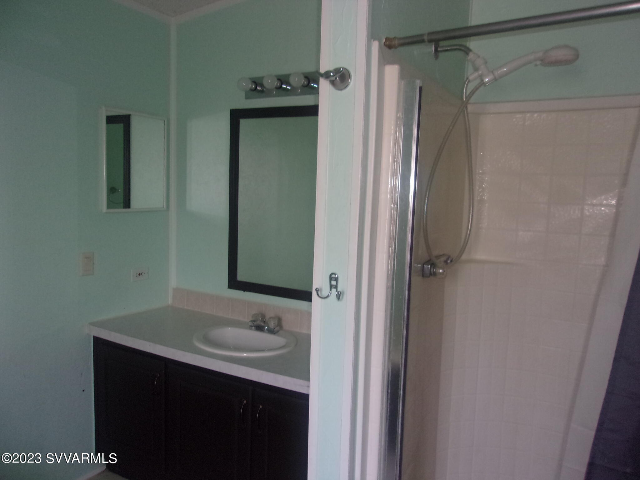 5925 Point Of View Trail Rimrock, AZ 86335 - Photo 16 of 35 a bathroom with a sink a mirror and shower