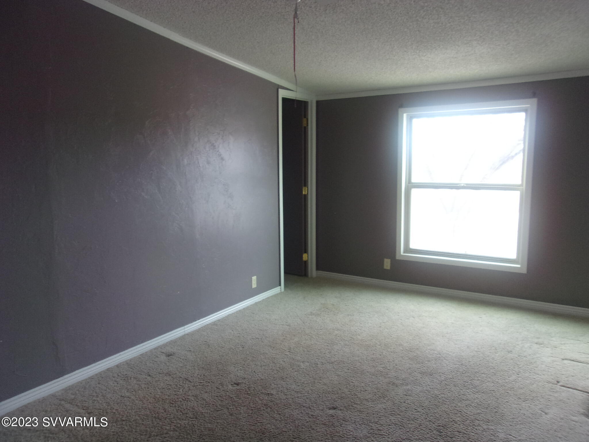 5925 Point Of View Trail Rimrock, AZ 86335 - Photo 19 of 35 an empty room with a empty space and windows