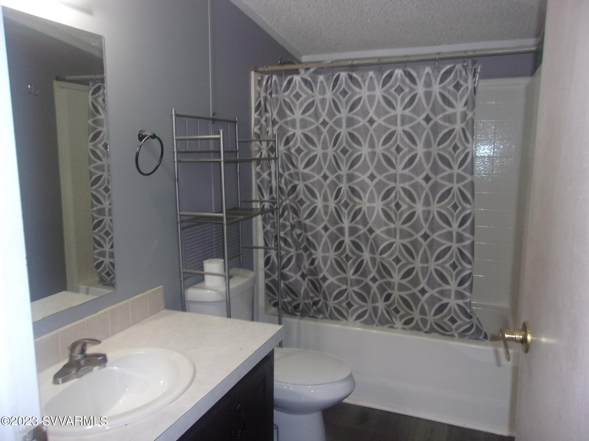 5925 Point Of View Trail Rimrock, AZ 86335 - Photo 21 of 35 a bathroom with a granite countertop sink and a toilet