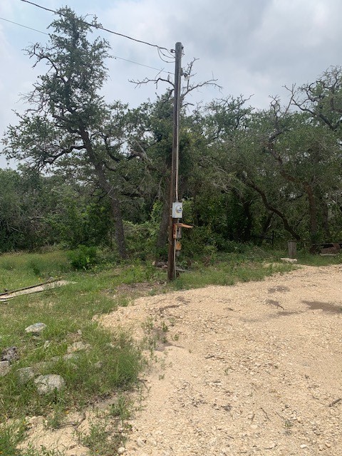 2993 Pump Station Road Wimberley, TX 78676 - Photo 17 of 21 a backyard of a house with lots of green space